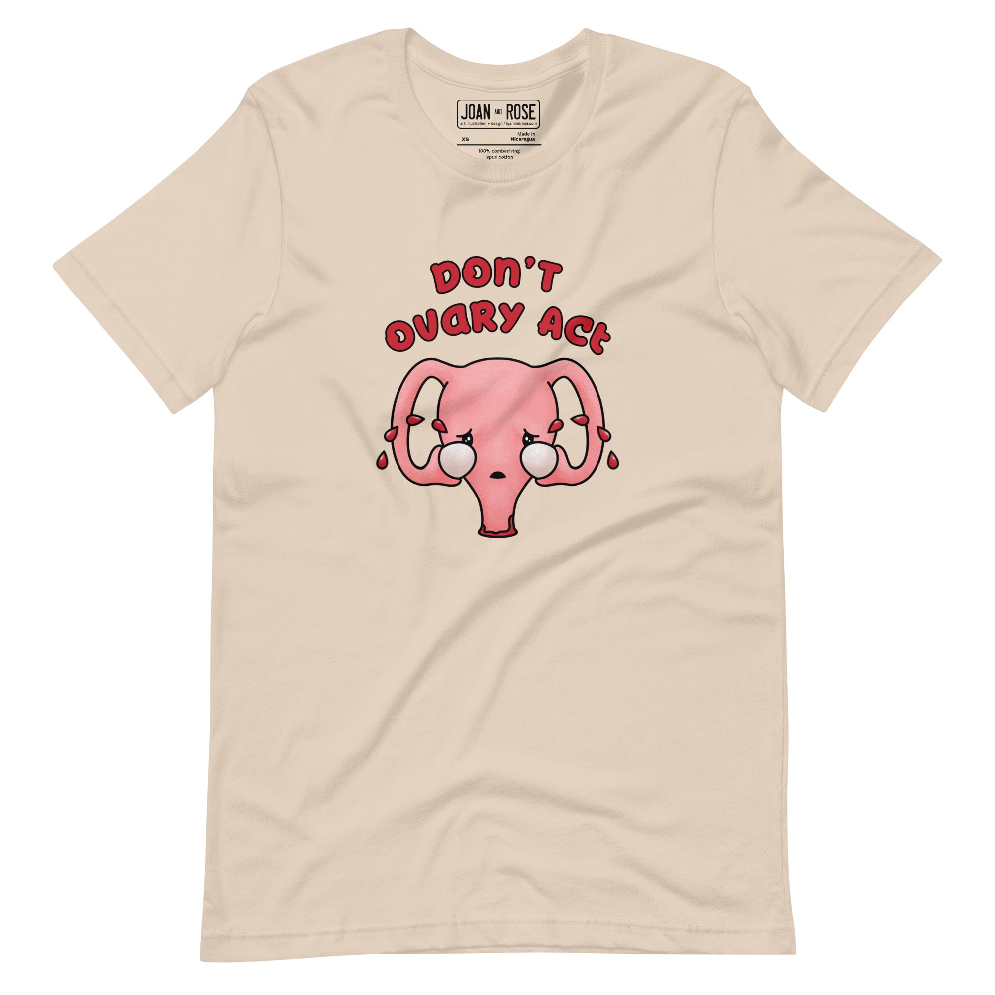 Cream coloured  t-shirt with an illustration of a cute uterus character crying with tears of blood with the text in red Don't Ovary Act